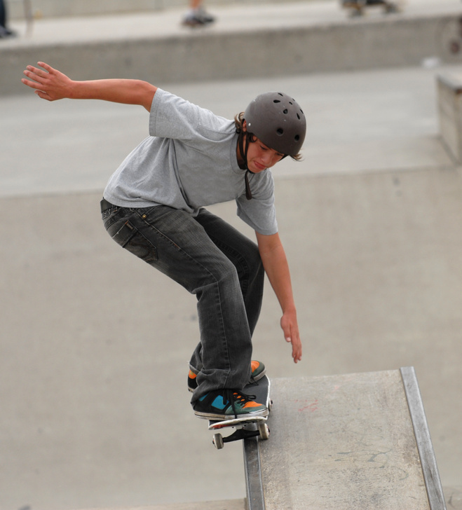Boy Skate Boarding at Park